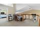 Versatile loft space with skylights, desk area, and views of the living space below at 6905 Arbor Oaks Ct, Bradenton, FL 34209
