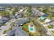 Community aerial view showcasing lush landscaping, community pool, and serene residential streets at 6907 Stoneywalk Ct, Bradenton, FL 34203