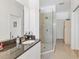 Modern bathroom features granite countertops, a sink, a glass-enclosed shower, and vanity at 6907 Stoneywalk Ct, Bradenton, FL 34203