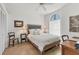 Bright bedroom features wood floors, a ceiling fan, and a large window at 6907 Stoneywalk Ct, Bradenton, FL 34203