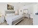 Bright bedroom featuring a comfortable bed, light-colored floors, and a neutral color palette at 6907 Stoneywalk Ct, Bradenton, FL 34203
