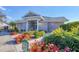 Well-maintained clubhouse featuring colorful landscaping and inviting entrance at 6907 Stoneywalk Ct, Bradenton, FL 34203