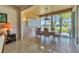 Bright dining room boasts tile floors, large windows, and stylish chandelier and is ideal for entertaining guests at 6907 Stoneywalk Ct, Bradenton, FL 34203