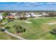 Scenic view of the golf course with well-manicured greens and surrounding homes at 6907 Stoneywalk Ct, Bradenton, FL 34203