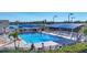 Sparkling pool area with comfortable seating, shaded areas, and lush landscaping at 6907 Stoneywalk Ct, Bradenton, FL 34203