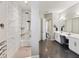 Luxurious bathroom with a tiled shower and double vanity sink at 6913 Neopolitan Ct, Apollo Beach, FL 33572