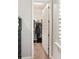 Walk-in closet with organized clothing racks and shelving, maximizing storage space at 6913 Neopolitan Ct, Apollo Beach, FL 33572