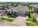 Charming single-Gathering home with a well-manicured front yard, a spacious driveway, and a three-car garage at 6913 Neopolitan Ct, Apollo Beach, FL 33572