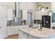 Beautiful kitchen featuring a center island, stainless steel appliances, and decorative pendant lighting at 6913 Neopolitan Ct, Apollo Beach, FL 33572