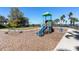 Community playground with climbing structure, swings, and views of the lake at 6913 Neopolitan Ct, Apollo Beach, FL 33572