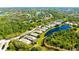 Aerial view of several homes by the water with beautiful landscaping at 7004 Old Tabby Cir, Lakewood Ranch, FL 34202
