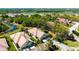 Aerial view of the property and its lush green surroundings, including a nearby golf course at 7004 Old Tabby Cir, Lakewood Ranch, FL 34202
