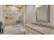Full bathroom with a tile surround shower and a granite countertop sink at 7004 Old Tabby Cir, Lakewood Ranch, FL 34202