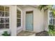 Inviting front entry with a stylish door, complementing the home's architectural details and curb appeal at 7004 Old Tabby Cir, Lakewood Ranch, FL 34202