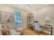Home office with wood floors, a ceiling fan and lots of natural light at 7004 Old Tabby Cir, Lakewood Ranch, FL 34202