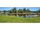 Pond surrounded by lush greenery, enhancing the natural beauty of the outdoor space at 7004 Old Tabby Cir, Lakewood Ranch, FL 34202