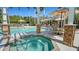 Community pool and spa area with comfortable seating and well-maintained surroundings at 7004 Old Tabby Cir, Lakewood Ranch, FL 34202