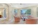 Cozy sitting room filled with natural light from expansive windows, enhancing the home's ambiance at 7004 Old Tabby Cir, Lakewood Ranch, FL 34202