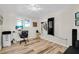Bright home office with wood flooring, natural light, and room for an exercise machine at 717 Guild Dr, Venice, FL 34285