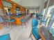 The bar is equipped with a full selection of drinks, ample seating, and tables near large windows at 730 Foggy Morn Ln, Bradenton, FL 34212