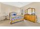 Bedroom with a bed, side table and dresser at 730 Foggy Morn Ln, Bradenton, FL 34212