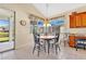 Eat-in dining area features a decorative light fixture and bright natural light from windows at 730 Foggy Morn Ln, Bradenton, FL 34212