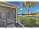Screened lanai with a view of the lake at 730 Foggy Morn Ln, Bradenton, FL 34212