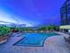 The outdoor pool boasts lounge chairs, umbrellas, and a view of the nearby waterway at twilight at 730 Foggy Morn Ln, Bradenton, FL 34212