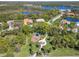 Beautiful aerial view of the community featuring lush landscaping, serene lakes, and a playground at 742 Shadow Bay Way, Osprey, FL 34229