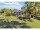 Well-maintained lawn and fenced yard offering privacy for poolside enjoyment at 742 Shadow Bay Way, Osprey, FL 34229
