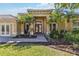 Inviting entryway with double doors and manicured landscaping, offering a glimpse of the well-maintained property at 742 Shadow Bay Way, Osprey, FL 34229