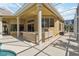 Covered outdoor cooking area located by a screened-in pool and lanai at 742 Shadow Bay Way, Osprey, FL 34229