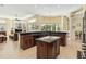 Spacious kitchen includes an island, dark wood cabinetry and countertops with seating at 742 Shadow Bay Way, Osprey, FL 34229