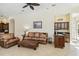 Cozy living room features a leather sofa set and built-in wet bar at 742 Shadow Bay Way, Osprey, FL 34229