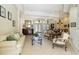 Spacious living room featuring tile floors, classic furniture, and an open layout ideal for entertaining at 742 Shadow Bay Way, Osprey, FL 34229