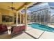 Inviting screened pool with spa and covered patio, perfect for outdoor relaxation and entertaining at 742 Shadow Bay Way, Osprey, FL 34229