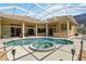 Backyard oasis featuring a sparkling pool with an attached spa, surrounded by a large patio at 742 Shadow Bay Way, Osprey, FL 34229