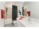 Bathroom with dual shower and granite countertops at 7712 Saloon Ln, Sarasota, FL 34240