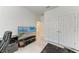 Bright bedroom with modern floors, large closet, and a TV for entertainment at 7712 Saloon Ln, Sarasota, FL 34240