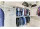 Walk-in closet with custom shelving, hanging rods, and drawers to maximize organization at 7712 Saloon Ln, Sarasota, FL 34240