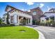 The clubhouse entrance features stone accents, manicured landscaping, and covered entrance at 7977 Bowspirit Way, Lakewood Ranch, FL 34202