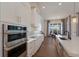 Bright kitchen features modern appliances, stainless steel oven and microwave, and a breakfast nook area at 7977 Bowspirit Way, Lakewood Ranch, FL 34202