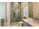 Stylish bathroom boasts modern tile, glass shower, and sleek vanity with ample counter space at 8348 Catamaran Cir, Lakewood Ranch, FL 34202