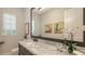 Powder room with a marble countertop and decorative accents at 8348 Catamaran Cir, Lakewood Ranch, FL 34202