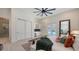 Bedroom with a wet bar, wine cooler, and access to the backyard swimming pool at 8348 Catamaran Cir, Lakewood Ranch, FL 34202