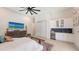 Bright bedroom with wet bar, wine cooler, TV, and sliding door closet at 8348 Catamaran Cir, Lakewood Ranch, FL 34202