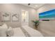 Cozy bedroom with beach view displayed on a modern flat screen TV at 8348 Catamaran Cir, Lakewood Ranch, FL 34202