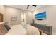 Bright bedroom featuring a TV, neutral decor and an ensuite bathroom at 8348 Catamaran Cir, Lakewood Ranch, FL 34202