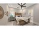 Comfortable bedroom with ceiling fan, wood furniture, and neutral decor at 8348 Catamaran Cir, Lakewood Ranch, FL 34202