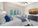 Bright main bedroom with a view of the pool and a ceiling fan at 8348 Catamaran Cir, Lakewood Ranch, FL 34202